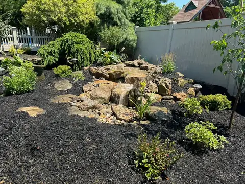 Pondless waterfall boulder set in Long Island, by Scott Anderson Design.