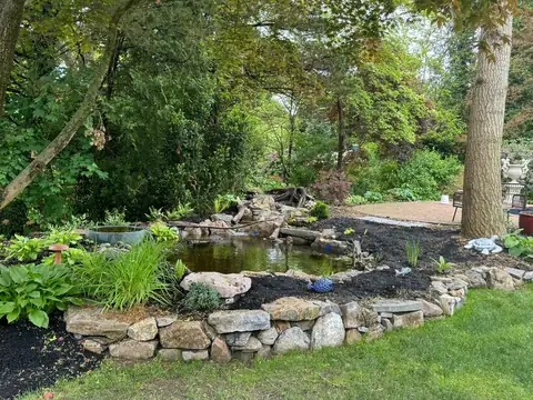 Romeo naturalistic pond in Northport, completed project, by Scott Anderson Design.