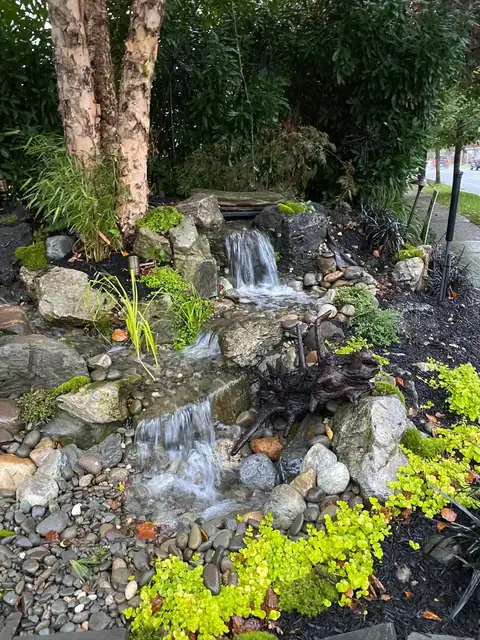 Pondless waterfall garden in Long Island, by Scott Anderson Design.