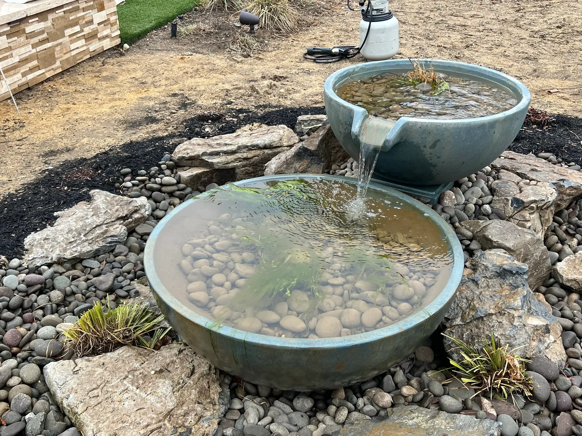 Russo Multi-Feature Water Garden in Rockville Centre, NY after construction, showing the finished spill bowls