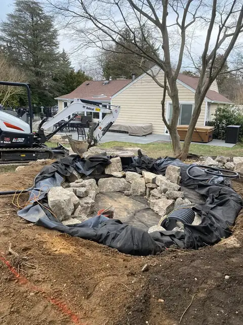 Romeo naturalistic pond in Northport, during construction, by Scott Anderson Design.