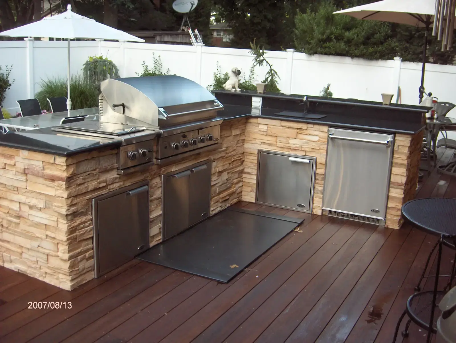 Outdoor kitchen with a stone base