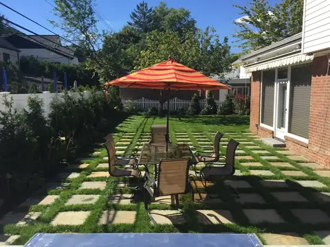 Paver and lawn checkerboard patio in Long Island, by Scott Anderson Design.