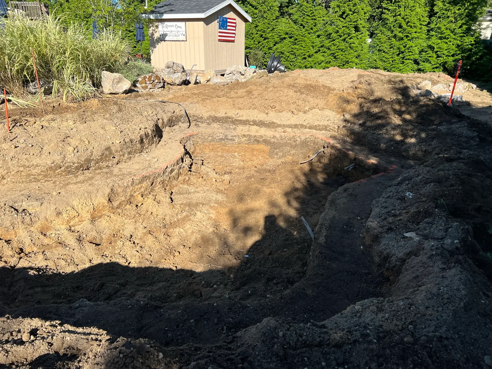 Russo Multi-Feature Water Garden in Rockville Centre, NY before construction, with the pond area excavated