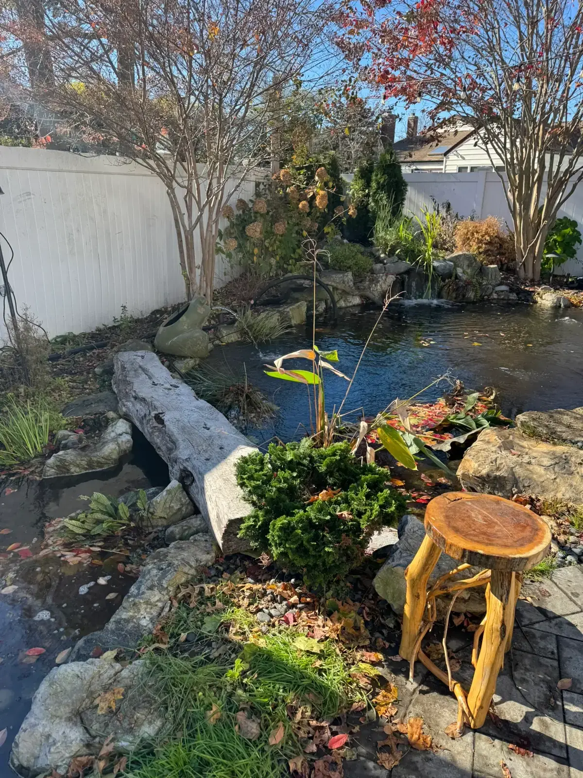 Shaded garden koi pond by Scott Anderson Design on Long Island